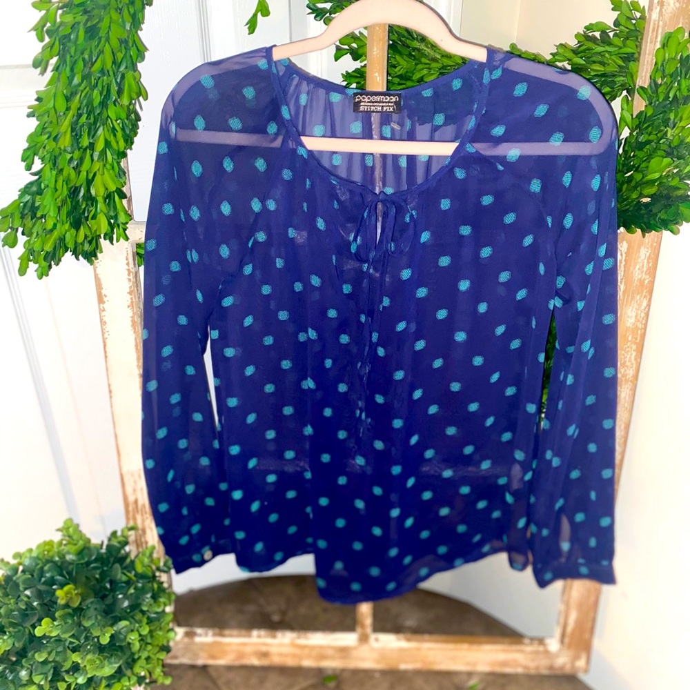 Green and blue polka dot shirt